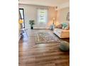 Inviting living room featuring wood floors and a comfortable seating arrangement at 141 Jones Franklin Rd # G, Raleigh, NC 27606