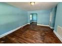 A large living room features wood floors and a view to an adjoining room at 1525 Hargrove St, Rocky Mount, NC 27801