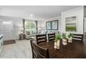 Bright living room showing stylish furniture, a door to the outside and a large window for natural light at 1537 Ivy Meadow Ln, Zebulon, NC 27597