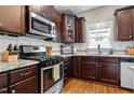 Well-equipped kitchen featuring a stainless steel range, granite counters, and ample cabinet space at 240 Paddy Ln, Youngsville, NC 27596