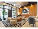 Comfortable lobby with modern decor, including a unique light fixture and stylish furniture at 317 W Morgan St # 320, Raleigh, NC 27601