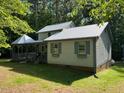 Charming home featuring a gazebo, covered porch and metal roof at 358 Pool Rock Shores Ln, Henderson, NC 27537