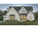 Elegant gray brick home with multi-level gables, porch, and lush landscaping at 46 Addison Pond Ct, Zebulon, NC 27597