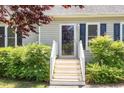 Close-up of front door and entrance steps with nice shrubs and classic black shutters at 809 Maple Shade Ln, Apex, NC 27502