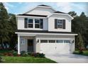 New two-story home featuring a brick foundation and white siding with black shutters and a two car garage at 817 Ottawa Dr, Garner, NC 27529
