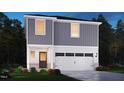 Charming two-story home with white trim, a two-car garage, and landscaped front yard at 825 Ottawa Dr, Garner, NC 27529