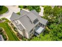 An aerial view of the rear of this home showcasing the spacious deck at 98102 Drummond, Chapel Hill, NC 27517