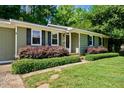 Inviting home exterior with manicured shrubs and a well-kept grassy lawn at 105 Choyce Ct, Garner, NC 27529