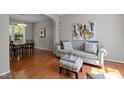 Inviting living room with hardwood floors and lots of natural light at 110 Fairchild Downs Pl, Cary, NC 27518