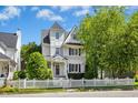 Charming two-story home featuring a beautiful white picket fence and well-manicured landscaping at 111 Chancellors Ridge Dr, Durham, NC 27713