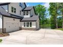 Spacious three-car garage with lake view, offering ample parking and extra storage at 248 Ashford Dr, Pittsboro, NC 27312