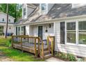 Close-up of the inviting front porch with wooden railings and charming details, leading to the home's entrance at 3 Haggis Ct, Durham, NC 27705