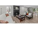 Comfortable living room featuring a cozy fireplace, modern furnishings, and ample natural light at 3 Haggis Ct, Durham, NC 27705