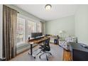 Bright office space featuring a large window, desk, and comfortable chair at 300 Redhill Rd, Holly Springs, NC 27540