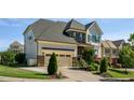 Beautiful home with a two car garage, stone accents, landscaped front yard, and a wide driveway at 3128 Mountain Hill Dr, Wake Forest, NC 27587