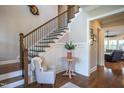 Bright foyer with hardwood floors, wainscoting, staircase and elegant trim at 3128 Mountain Hill Dr, Wake Forest, NC 27587