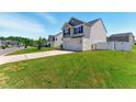 Well-maintained two-story home featuring a two-car garage and a lush green lawn at 350 Pillow Ln, Burlington, NC 27217