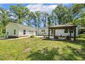 Spacious backyard featuring an outdoor patio with gazebo and attached garage at 418 S West St, Cary, NC 27511