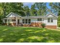 Beautiful single-story home with a brick foundation and a well-kept front lawn at 418 S West St, Cary, NC 27511