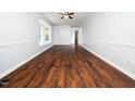 Spacious living room showcasing hardwood floors, a bay window, and neutral wall paint at 4605 Malor Dr, Wake Forest, NC 27587