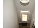 Bright entryway with light walls, wood floors, and a door with window panels at 474 Ashpole Trl, Clayton, NC 27520