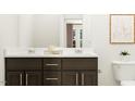 This new bathroom offers dual sinks, white countertops, and a view of the door to the toilet at 88 Blossom Field Way, Angier, NC 27501