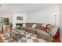 Cozy living room featuring a fireplace, stylish rug, and comfortable reclining sofa at 103 Coleridge Ct, Carrboro, NC 27510