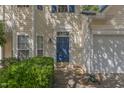 Attractive front door of home features a blue painted door, well-maintained landscaping, and inviting entryway at 1031 Lake Moraine Pl, Raleigh, NC 27607