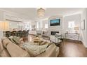 Bright, open living space with fireplace, hardwood floors, and seamless access to the modern kitchen at 129 Ruskin Dr, Chapel Hill, NC 27516