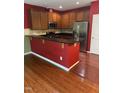 Well-appointed kitchen featuring granite countertops and stainless steel appliances at 1671 Holly Grove Way, Durham, NC 27713