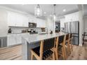 Spacious kitchen features white cabinets, stainless steel appliances and granite countertops at 220 Purslane Dr, Franklinton, NC 27525