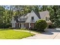 Beautiful two-story home with a lush lawn and a welcoming brick walkway at 2409 Beechview Ct, Raleigh, NC 27615