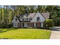Attractive two-story home featuring a well-kept lawn and traditional architecture at 2409 Beechview Ct, Raleigh, NC 27615