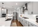 Stylish kitchen with stainless steel appliances, gray cabinetry, and white countertops at 272 High Woods Rdg, Chapel Hill, NC 27517