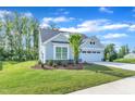 Beautiful home featuring a manicured lawn, a two-car garage and a concrete driveway at 30 Sawtooth Oak Ln, Youngsville, NC 27596