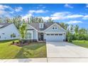 Beautiful home featuring a two-car garage, manicured lawn and lovely curb appeal at 30 Sawtooth Oak Ln, Youngsville, NC 27596