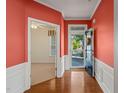 Bright foyer with hardwood floors and wainscoting leading into adjacent rooms at 340 Orbison Dr, Cary, NC 27519