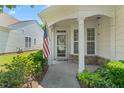 Inviting front porch with classic columns and decorative stone accents. A welcoming entryway! at 340 Orbison Dr, Cary, NC 27519