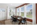 Sunlit dining area with table, chairs, and views of the outside at 352 Church St # 53, Wendell, NC 27591