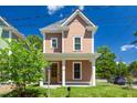 Lovely two-story home featuring a covered front porch, perfect for relaxing outdoors at 500 Spruce St, Durham, NC 27703