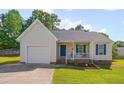 A single-story home with a one-car garage and front porch provides inviting curb appeal at 5316 Tanglewood Pine Ln, Raleigh, NC 27610