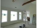 Bright living room featuring vaulted ceilings and large windows for natural light at 614 Tart Town Rd, Dunn, NC 28334