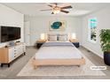 Comfortable main bedroom with soft carpet, ceiling fan, and stylish decor at 617 Hiddenbrook Dr, Durham, NC 27703