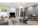 Modern living room with gray accent wall, contemporary furniture, and hardwood flooring at 710 Independence Pl # 103, Raleigh, NC 27603