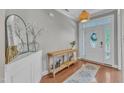 Inviting foyer with hardwood floors, stylish decor, and a view of the front door at 736 Varina Ln, Fuquay Varina, NC 27526