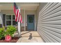 Charming front door with glass and inviting decor plus a Ring security system at 784 Cypress Rd, Cameron, NC 28326