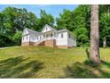 Attractive two-story home with a covered porch, and a well-maintained lawn at 10304 Stallion Way, Bahama, NC 27503