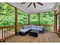 Cozy screened-in porch with comfortable seating, perfect for relaxing outdoors at 10304 Stallion Way, Bahama, NC 27503