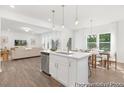 Island kitchen featuring an open floorplan connecting to dining and living areas at 105 Mable Court # 10, Lillington, NC 27546