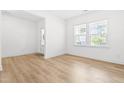Bright and airy living room features hardwood floors and natural light from large windows at 110 Hickory Grove Dr, Sanford, NC 27330